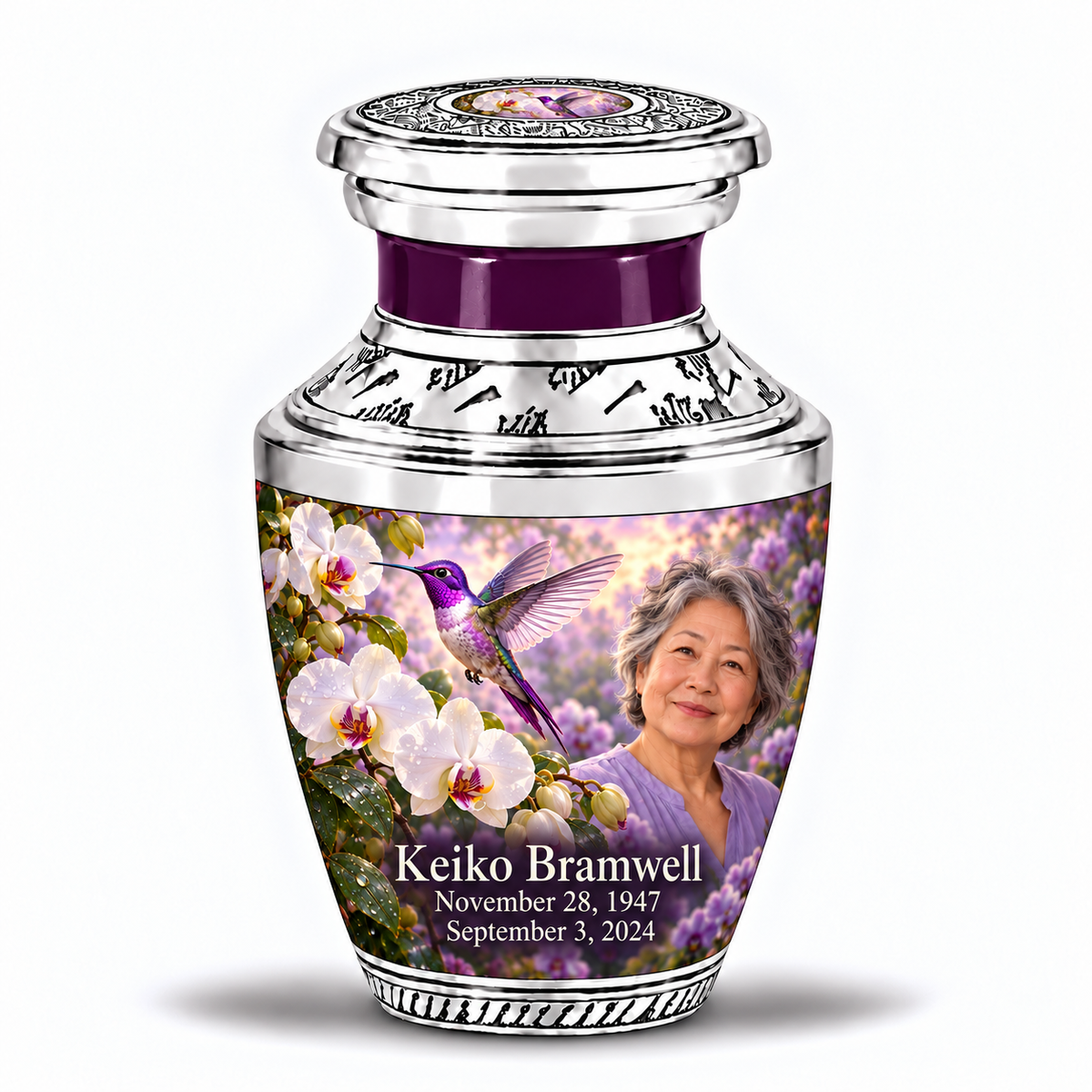One 3-inch Tasty keepsake with near-flat silver lid and violet hummingbird-white orchid inset, solid purple neck, matching body artwork and fictional Keiko Bramwell portrait and dates.