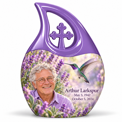 Large lavender Cross Drop urn with sculpted cross, emerald-violet hummingbird among lavender and Arthur Larkspur portrait, name and full dates.