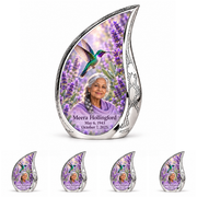 Large silver Curved Drop urn above four matching keepsakes, with lavender hummingbird gardens, engraved silver sidewalls and Meera Hollingford portraits.