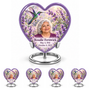 Large lavender Heart urn above four matching keepsakes, all on complete silver ring stands, with lavender garden hummingbird and Rosalie Fernwick portraits.