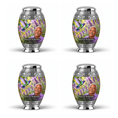 Four identical Monar keepsakes with silver engraved bands, green-violet hummingbirds at purple lavender and fictional Marcus Willowby portraits, May 2, 1939 to October 2, 2024.