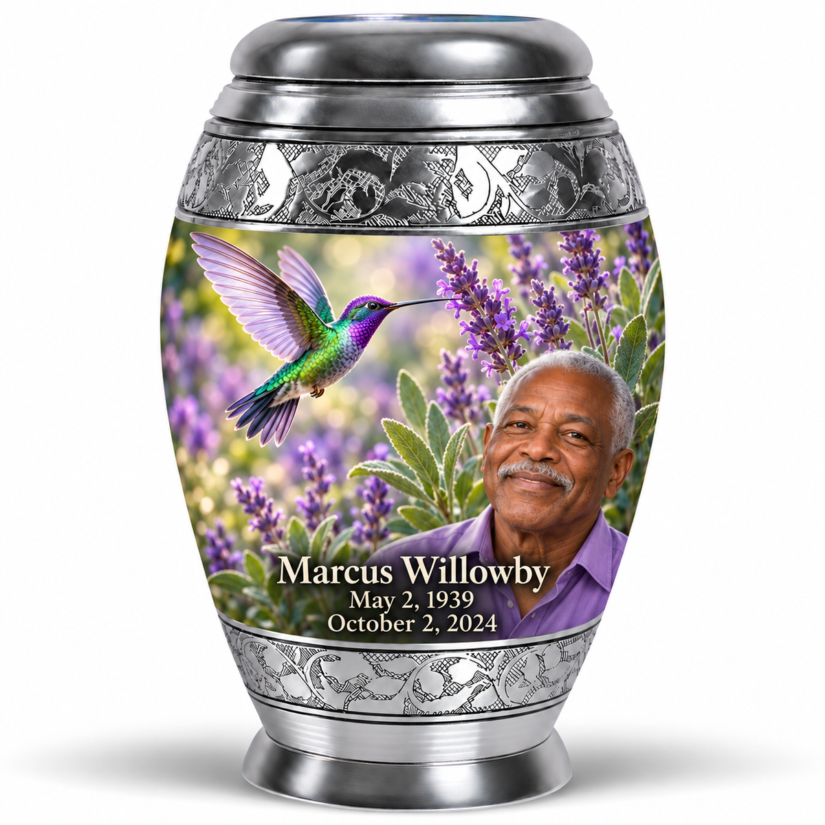One 10-inch Monar urn with silver engraved bands, green-violet hummingbirds at purple lavender and fictional Marcus Willowby portraits, May 2, 1939 to October 2, 2024.