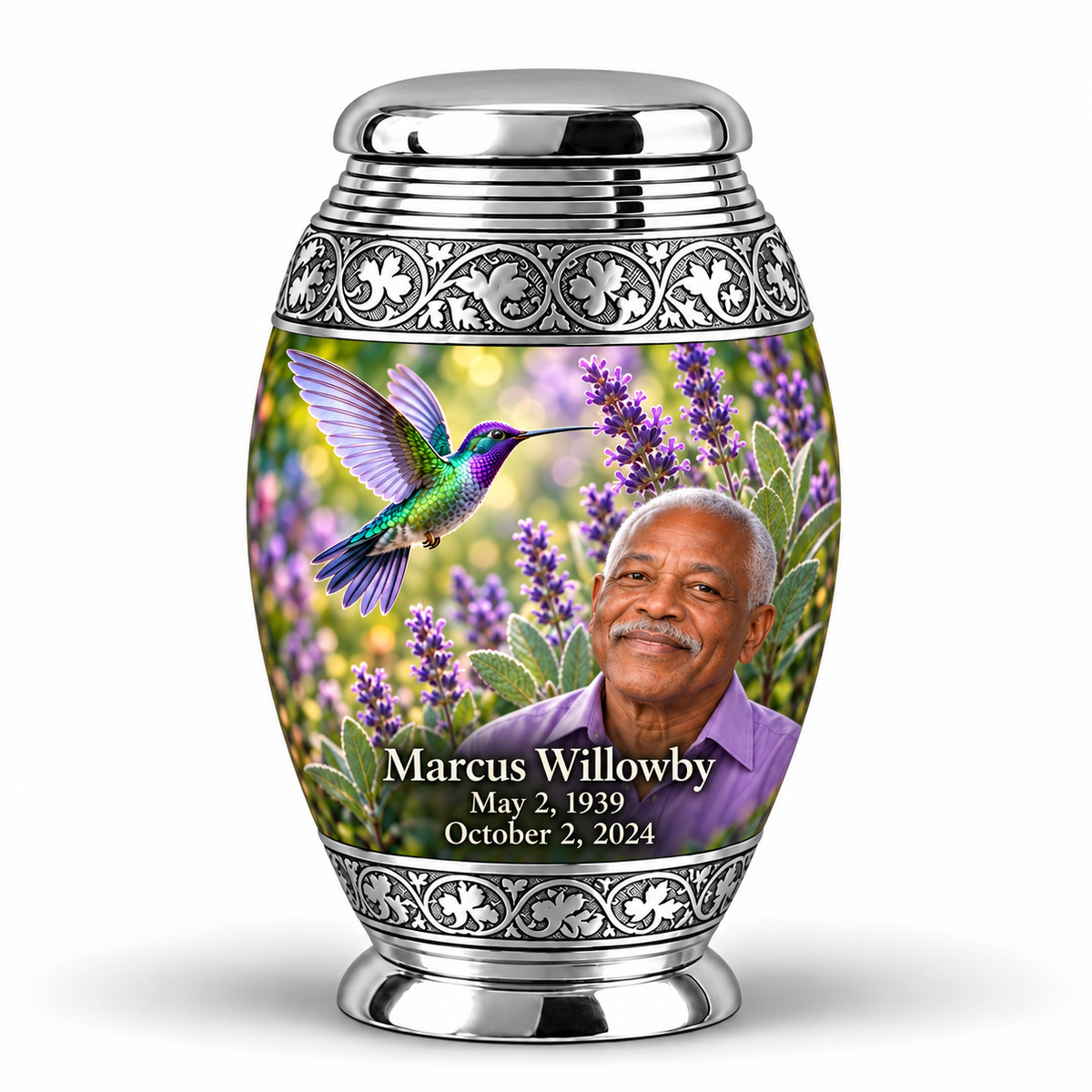 One 3-inch Monar keepsake with grooved neck and scroll bands with silver engraved bands, green-violet hummingbirds at purple lavender and fictional Marcus Willowby portraits, May 2, 1939 to October 2, 2024.