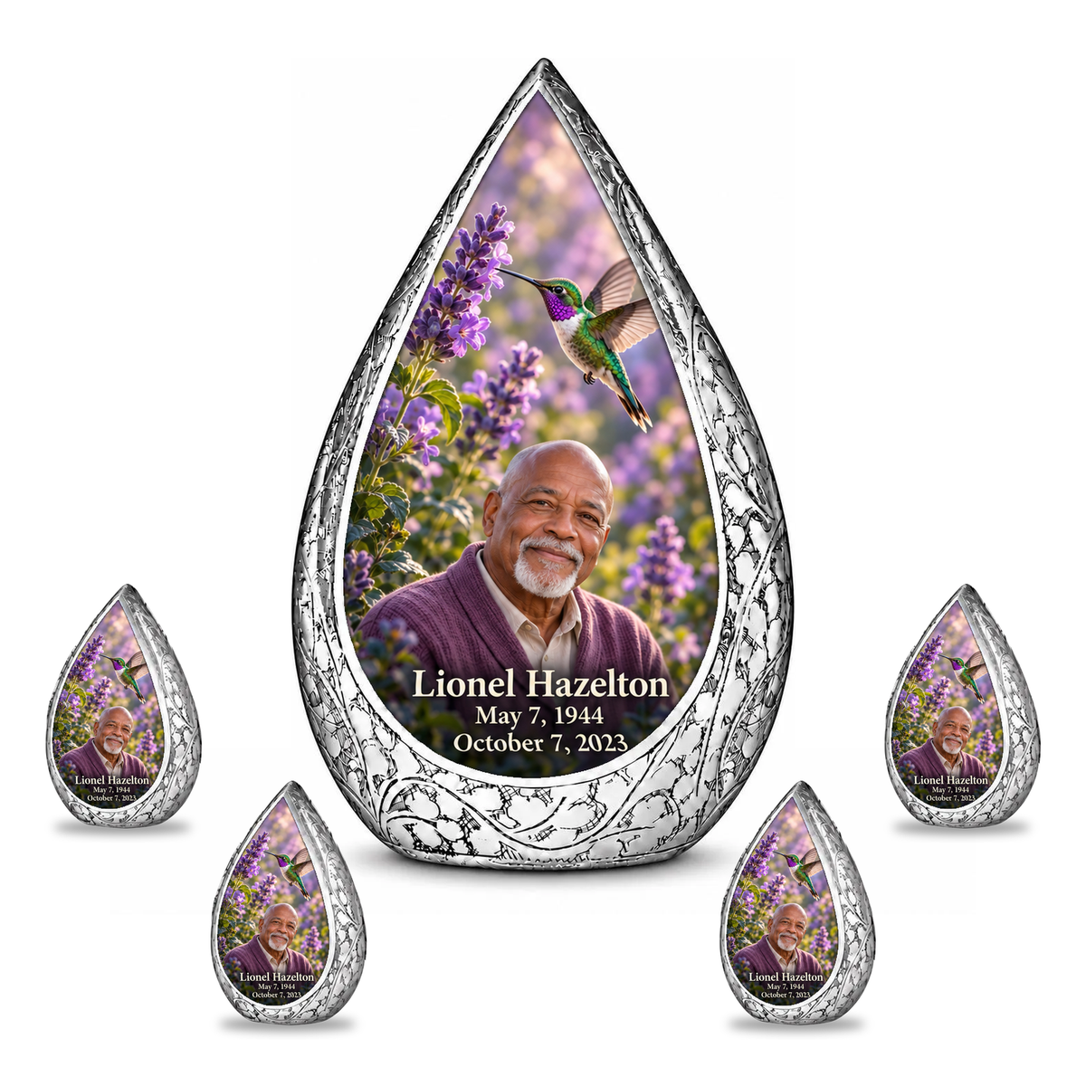 Large urn with four matching keepsakes Straight Drop memorial urn, emerald and violet hummingbird at lavender flowers, Lionel Hazelton portrait and full memorial dates, white background.