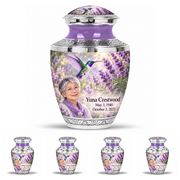 One large Tasty urn and four matching keepsakes with silver engraved trim, solid lavender necks, green-violet hummingbirds at lavender and fictional Yuna Crestwood portraits, May 3, 1940 to October 3, 2025.