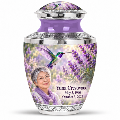 One 10-inch Tasty urn with domed artwork lid with silver engraved trim, solid lavender necks, green-violet hummingbirds at lavender and fictional Yuna Crestwood portraits, May 3, 1940 to October 3, 2025.