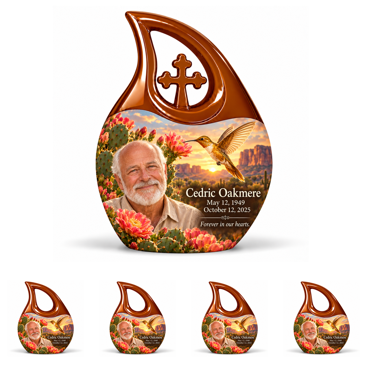Amber-brown Cross Drop urn with central cross above four matching open-loop keepsakes, golden desert hummingbird art and Cedric Oakmere portraits.