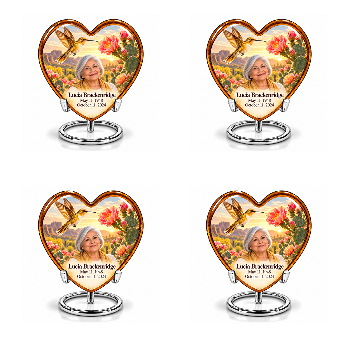 Four identical amber Heart keepsakes with golden hummingbirds, pink cactus blossoms and Lucia Brackenridge portraits on complete silver ring stands.
