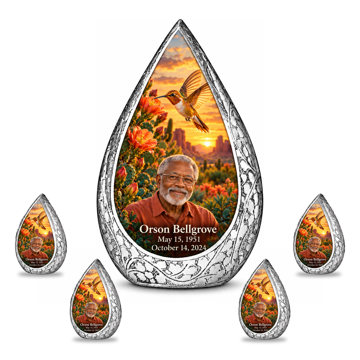 Large urn with four matching keepsakes Straight Drop memorial urn, golden hummingbird at orange desert cactus blooms, Orson Bellgrove portrait and full memorial dates, white background.