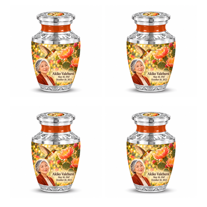 Four identical Tasty keepsakes with flat silver lids, orange necks, golden hummingbirds over desert blooms and Akiko Valehurst portraits and full dates.