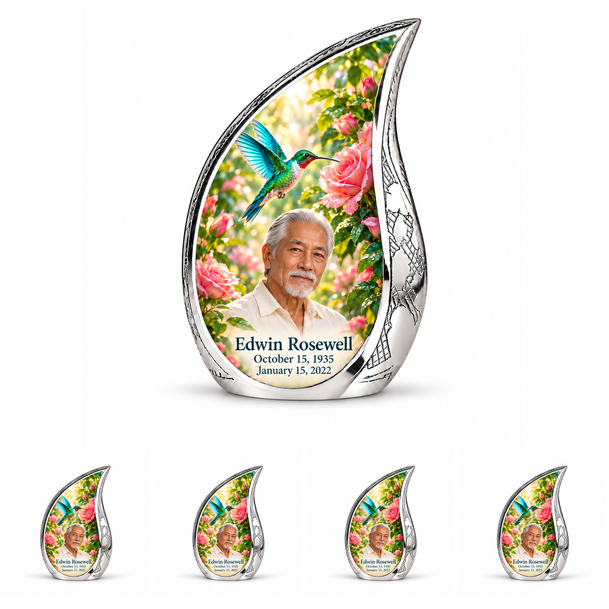 10 inch large Urn with 4 Keepsake 3 Inch Urns; Engraved silver Curved Drop with vivid turquoise and icy cyan hummingbird wings above soft pink roses and green leaves. Edwin Rosewell has a narrow angular East Asian face, swept-back silver hair, small white beard and cream shirt. Dark teal name and October 15, 1935 / January 15, 2022 dates are accurate.