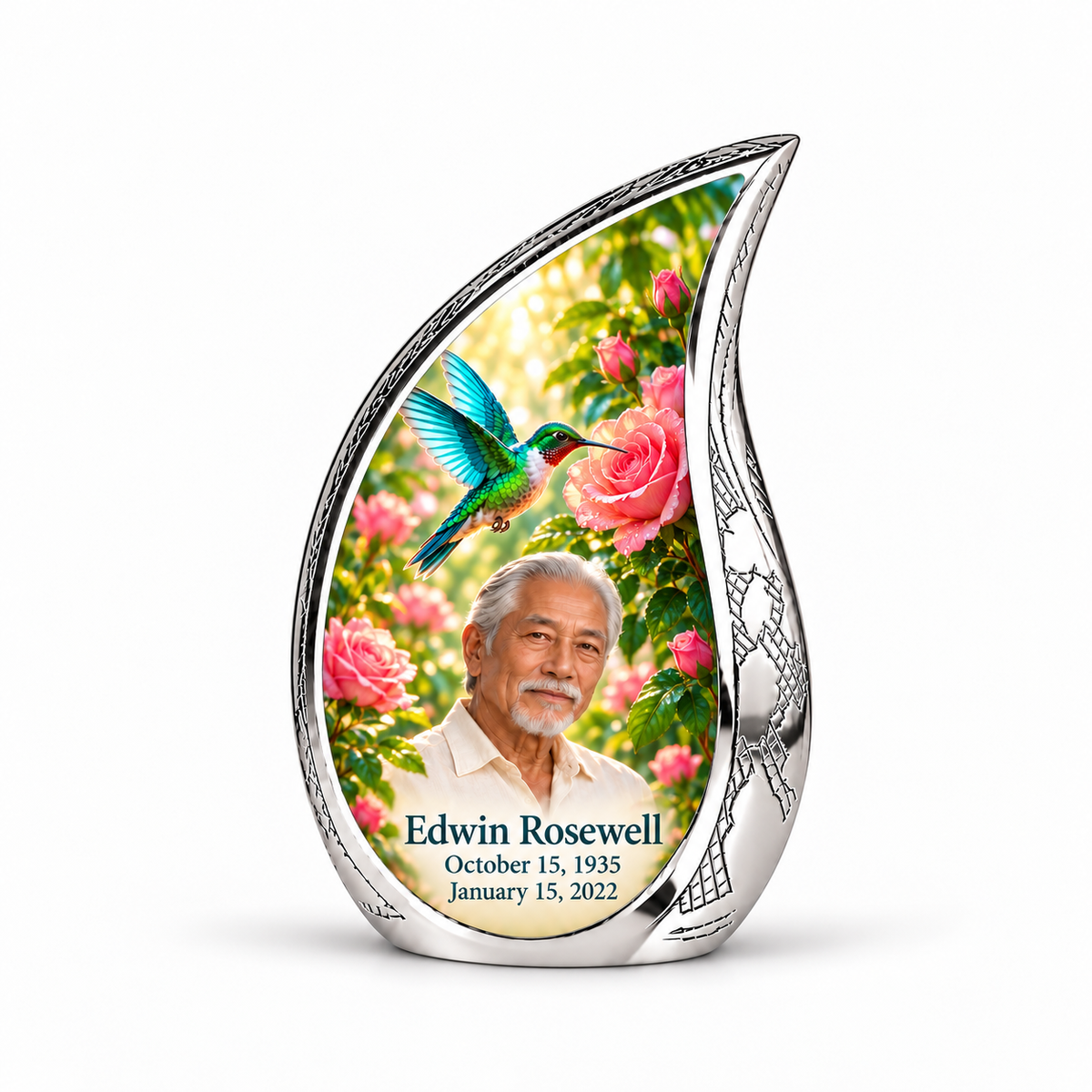 1 Keepsake 3 inch Urn; Engraved silver Curved Drop with vivid turquoise and icy cyan hummingbird wings above soft pink roses and green leaves. Edwin Rosewell has a narrow angular East Asian face, swept-back silver hair, small white beard and cream shirt. Dark teal name and October 15, 1935 / January 15, 2022 dates are accurate.