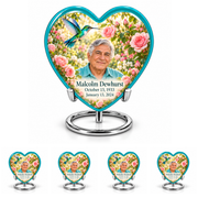 10 inch large Urn with 4 Keepsake 3 Inch Urns; Glossy turquoise Heart with turquoise-winged hummingbird above soft pink roses and a cream garden. Malcolm Dewhurst has a broad triangular clean-shaven face, curved nose, dark brows, thick swept silver hair and turquoise shirt. Dark teal name and October 13, 1933 / January 13, 2024 dates are accurate.