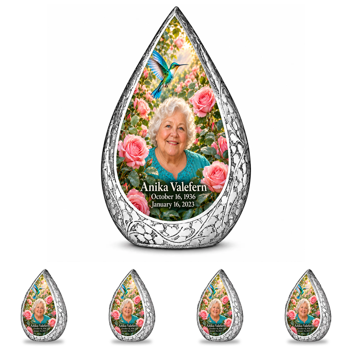 10 inch large Urn with 4 Keepsake 3 Inch Urns Straight Drop memorial urn, turquoise hummingbird among soft pink roses, Anika Valefern portrait and full memorial dates, white background.