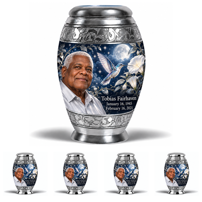 10 inch large Urn with 4 Keepsake 3 Inch Urns, Monar memorial urn with silver-blue hummingbird and starlit moonflowers, Tobias Fairhaven portrait, January 16, 1945 to February 16, 2021.