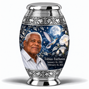 1 Keepsake 3 inch Urn, Monar memorial urn with silver-blue hummingbird and starlit moonflowers, Tobias Fairhaven portrait, January 16, 1945 to February 16, 2021.