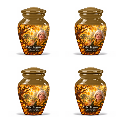 Four identical 3-inch keepsakes, Classic golden-ginkgo fan-leaf design with fictional Mabel Renshaw portrait, name and full memorial dates on white background.