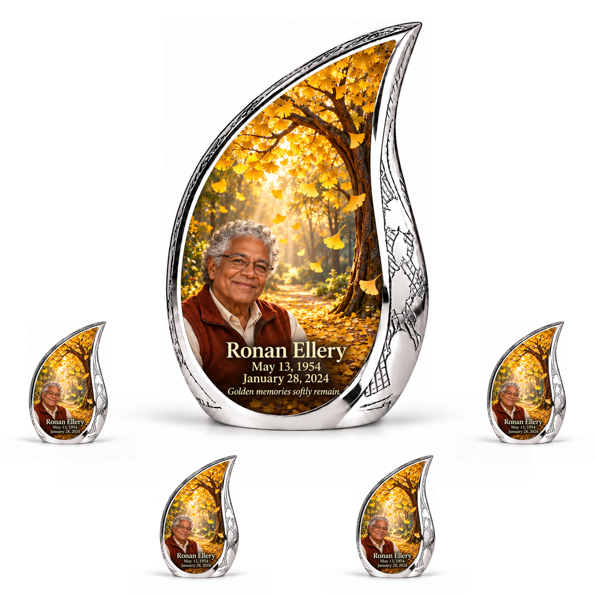 Tree of Life 20 Curved Drop, 10 inch large Urn with 4 Keepsake 3 Inch Urns: golden ginkgo fan leaves falling through amber sunlight; fictional Ronan Ellery portrait, name and full dates, engraved silver frame.