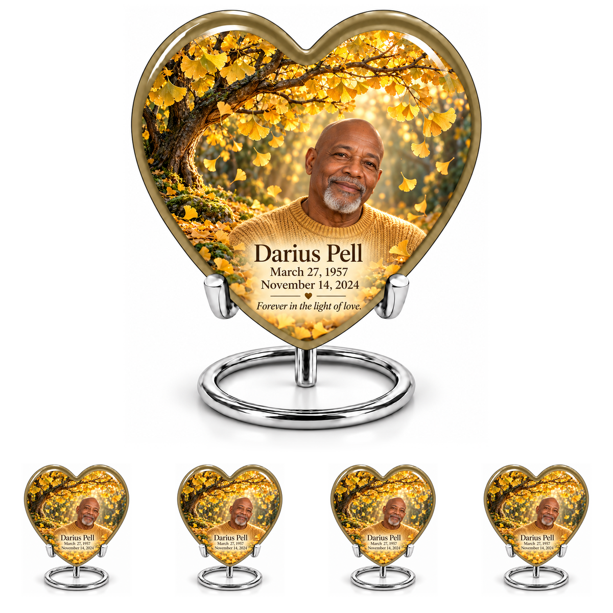 Tree of Life 20 Heart combo with one large quoted urn above four matching keepsakes at 30% height, all showing golden ginkgo leaves, fictional Darius Pell portrait and dates on silver stands.