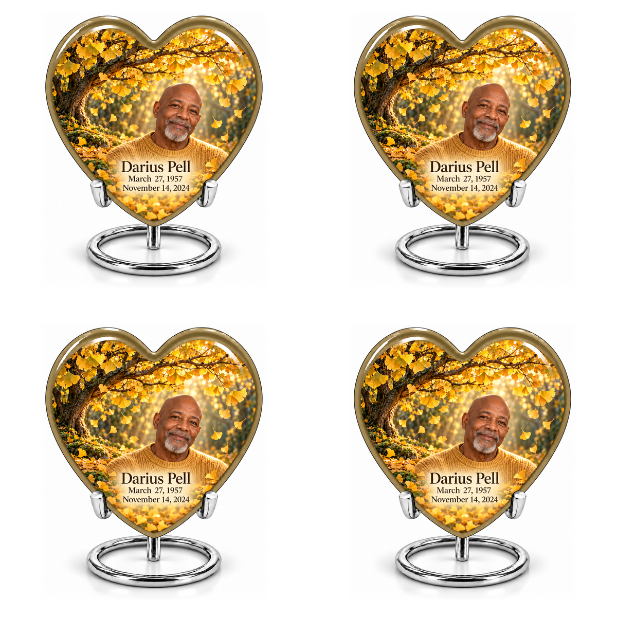 Tree of Life 20 set of four identical Heart keepsakes in two rows, each showing gold ginkgo leaves, fictional Darius Pell portrait and full dates on complete silver ring stands.