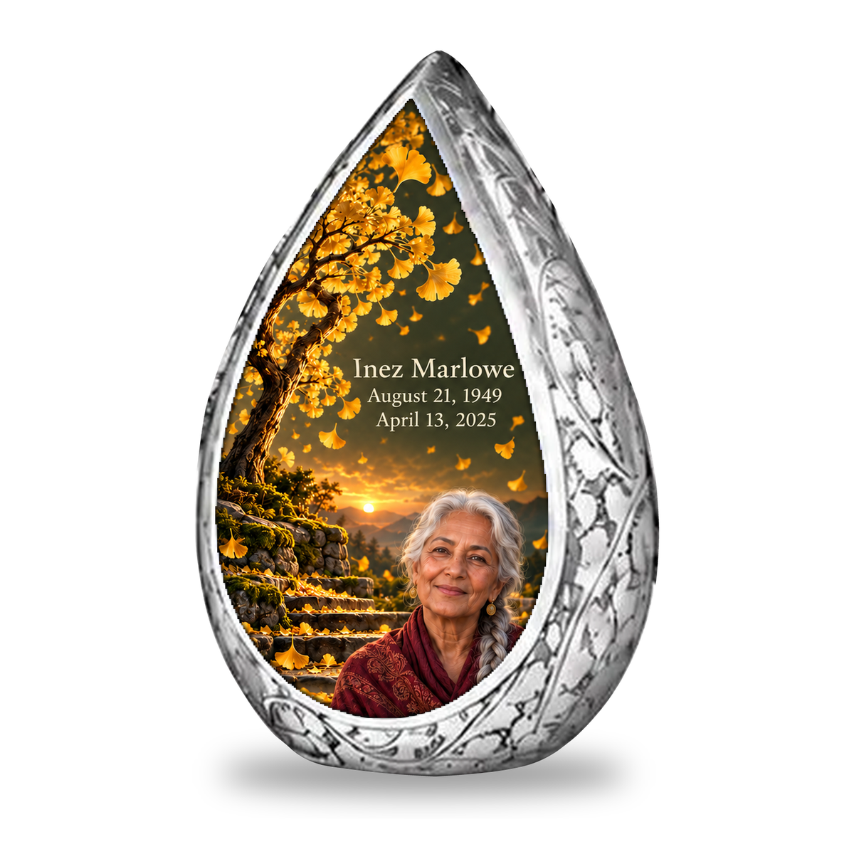 Tree of Life 20 Straight Drop, 1 Keepsake 3 inch Urn: original engraved silver surrounding golden ginkgo fan leaves, olive dusk sky and mossy stone steps, with fictional Inez Marlowe portrait, name and full dates.